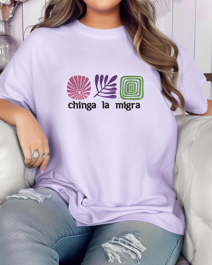 A woman wearing a purple t-shirt with a graphic design and text printed on it.