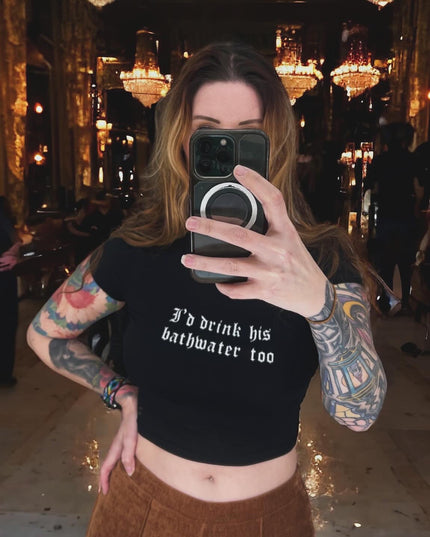 a woman taking a picture of herself in a mirror