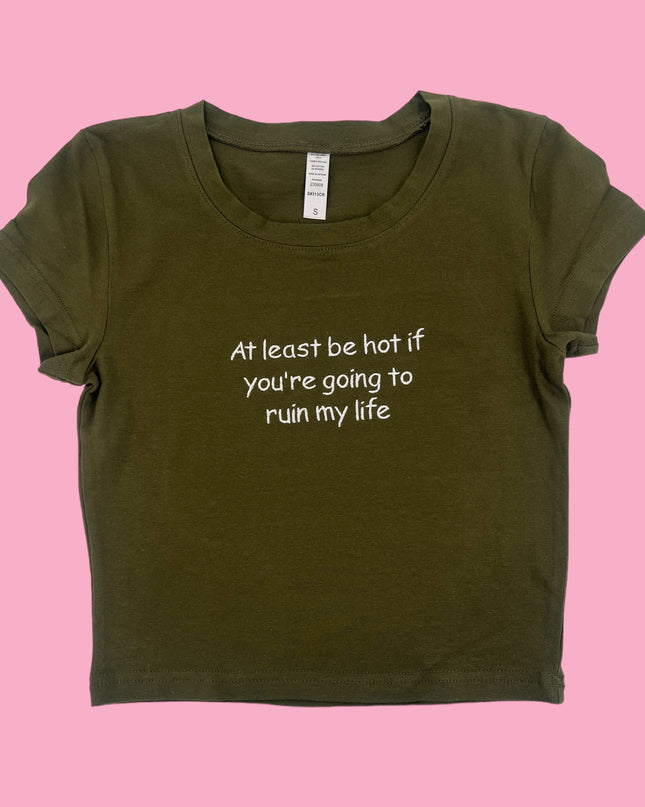 a t - shirt that says at least be hot if you're going to
