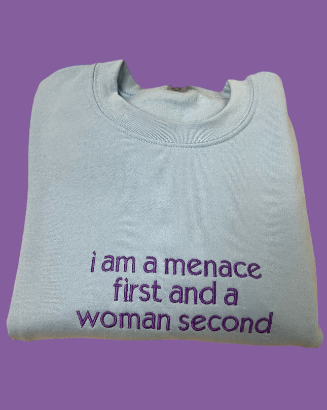 a t - shirt that says i am a menache first and a woman second