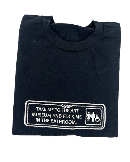 a black t - shirt with a sign that says take me to the museum and