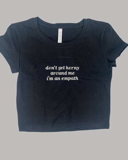 a black t - shirt with the words don&#39;t get horny, stand