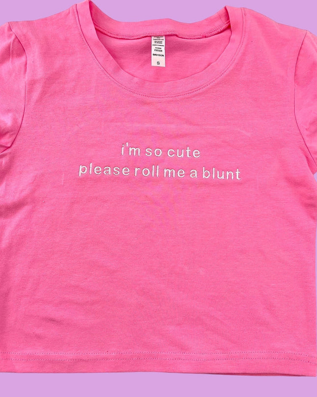 a pink shirt that says i&#39;m so cute please roll me a blunt