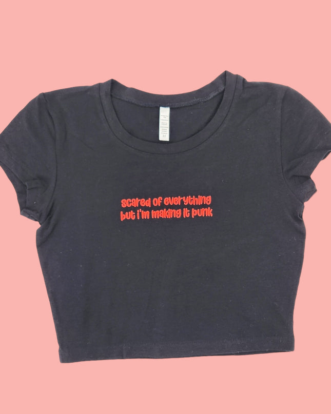 a black t - shirt with a message on it