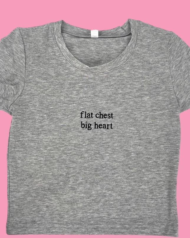 a t - shirt that says flat chest, big heart