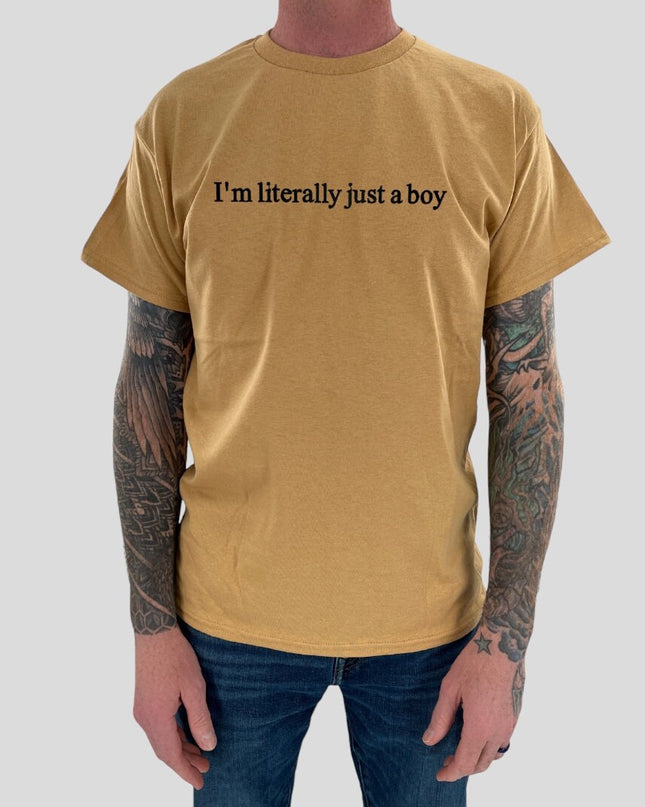 a man with a tattooed arm wearing a mustard colored t - shirt