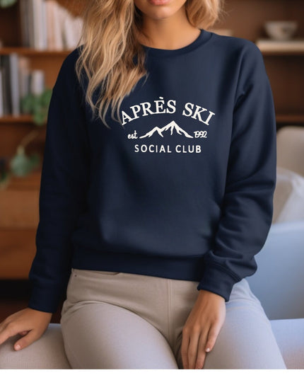 a woman sitting on a chair wearing a sweatshirt