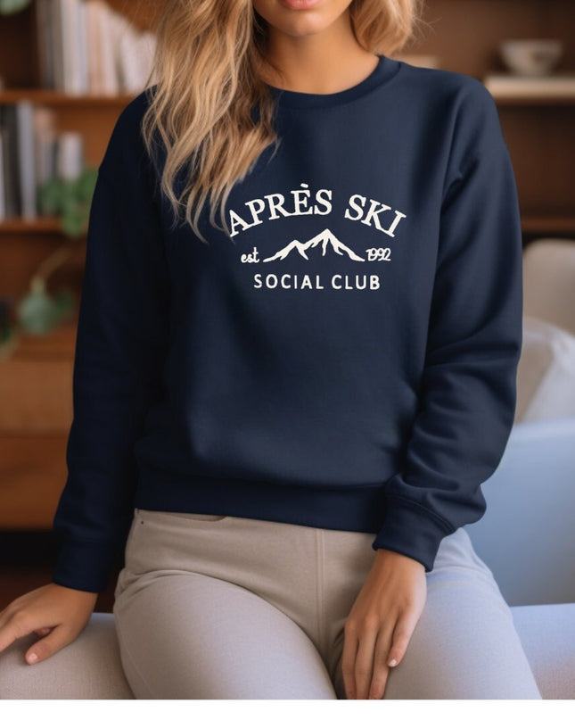 a woman sitting on a chair wearing a sweatshirt