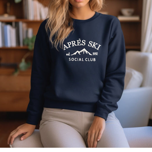 a woman sitting on a chair wearing a sweatshirt