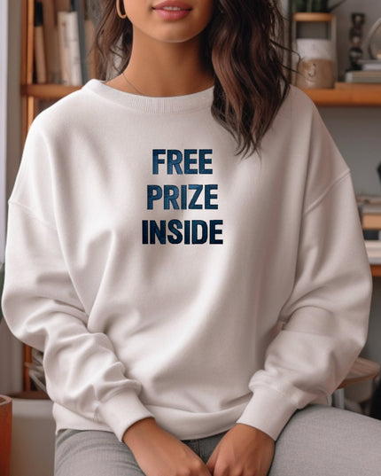 a woman sitting on a couch wearing a white sweatshirt with the words free prize inside