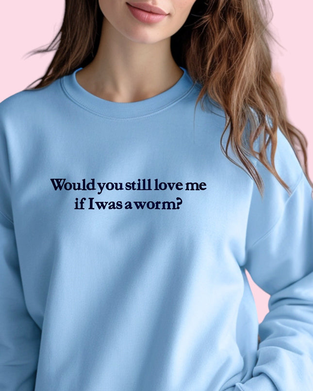 a woman wearing a blue sweatshirt that says would you still love me if i was