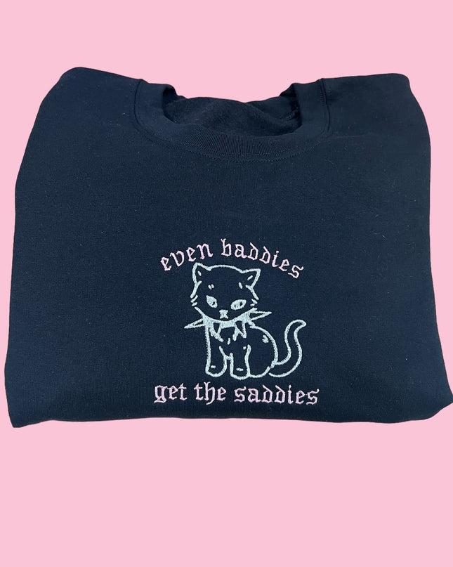 a black bag with a white cat on it