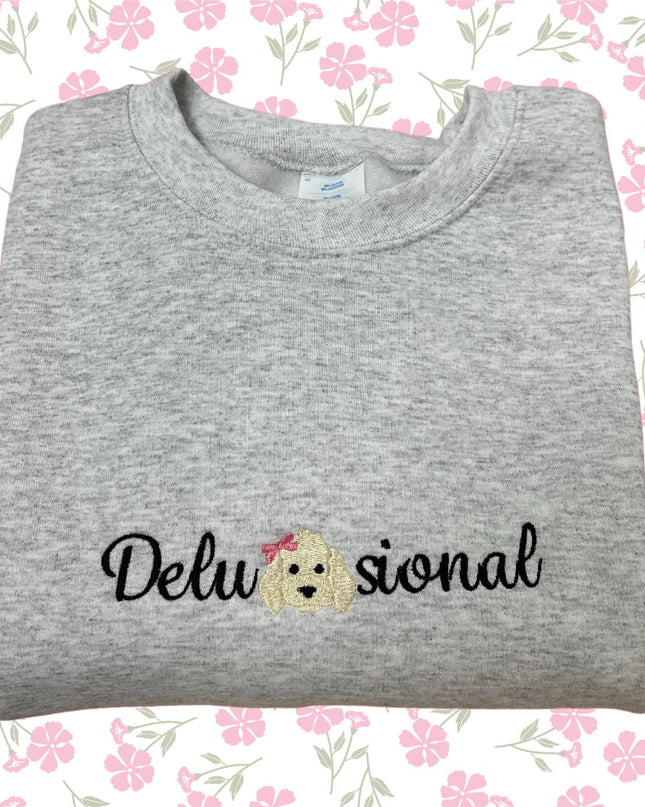 a grey shirt with a dog embroidered on it