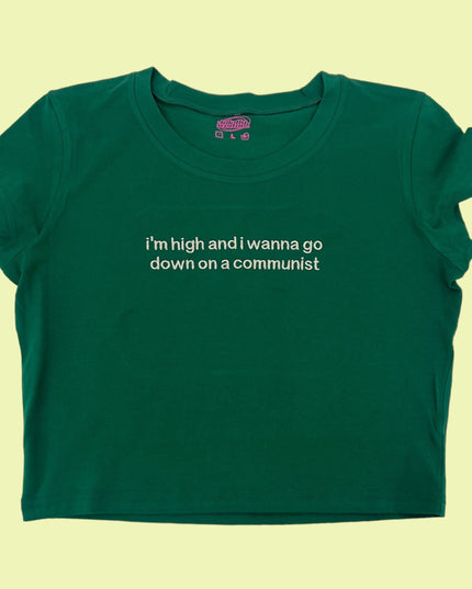 a green t - shirt with a quote on it